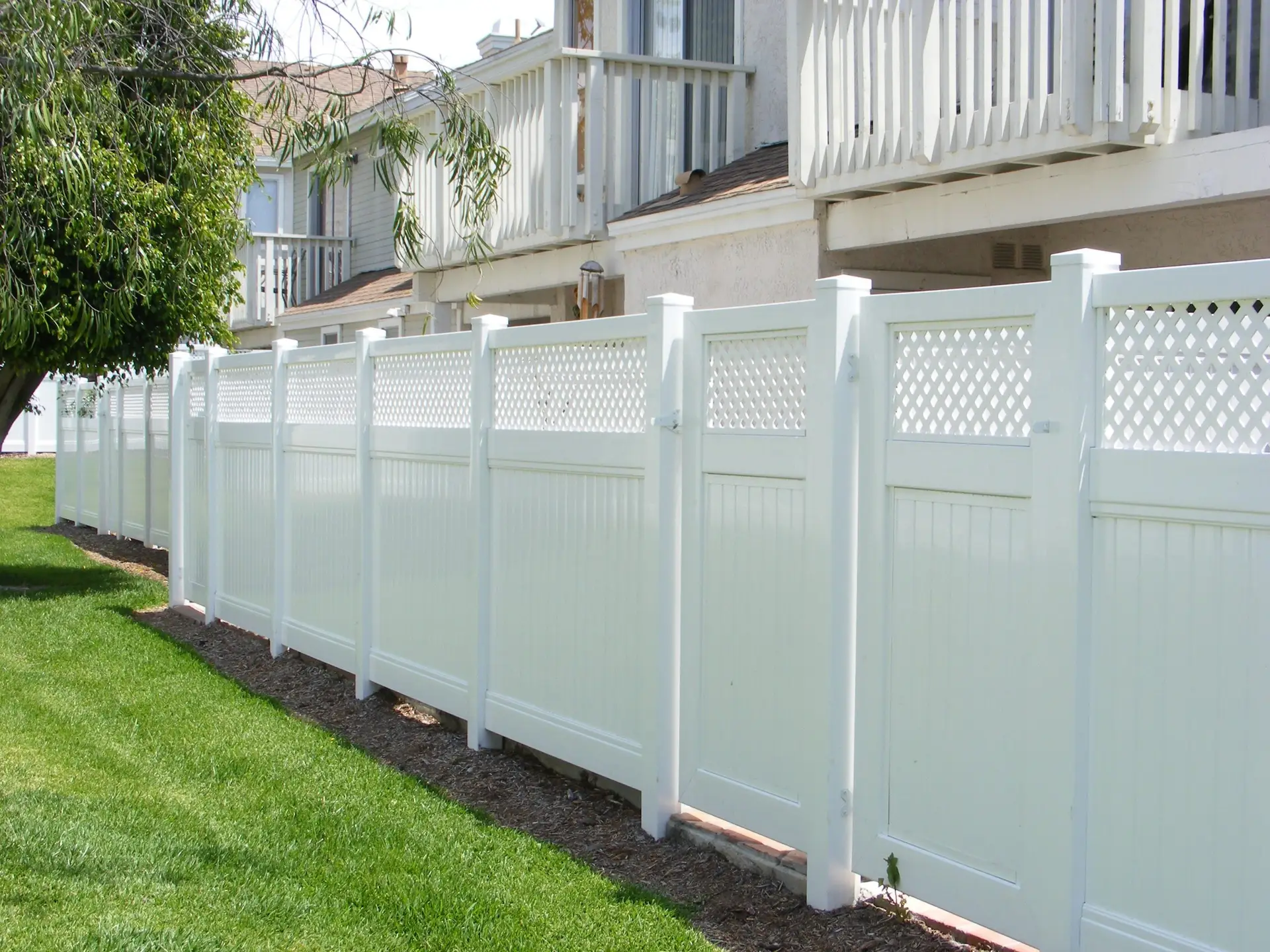 white fence with green grass