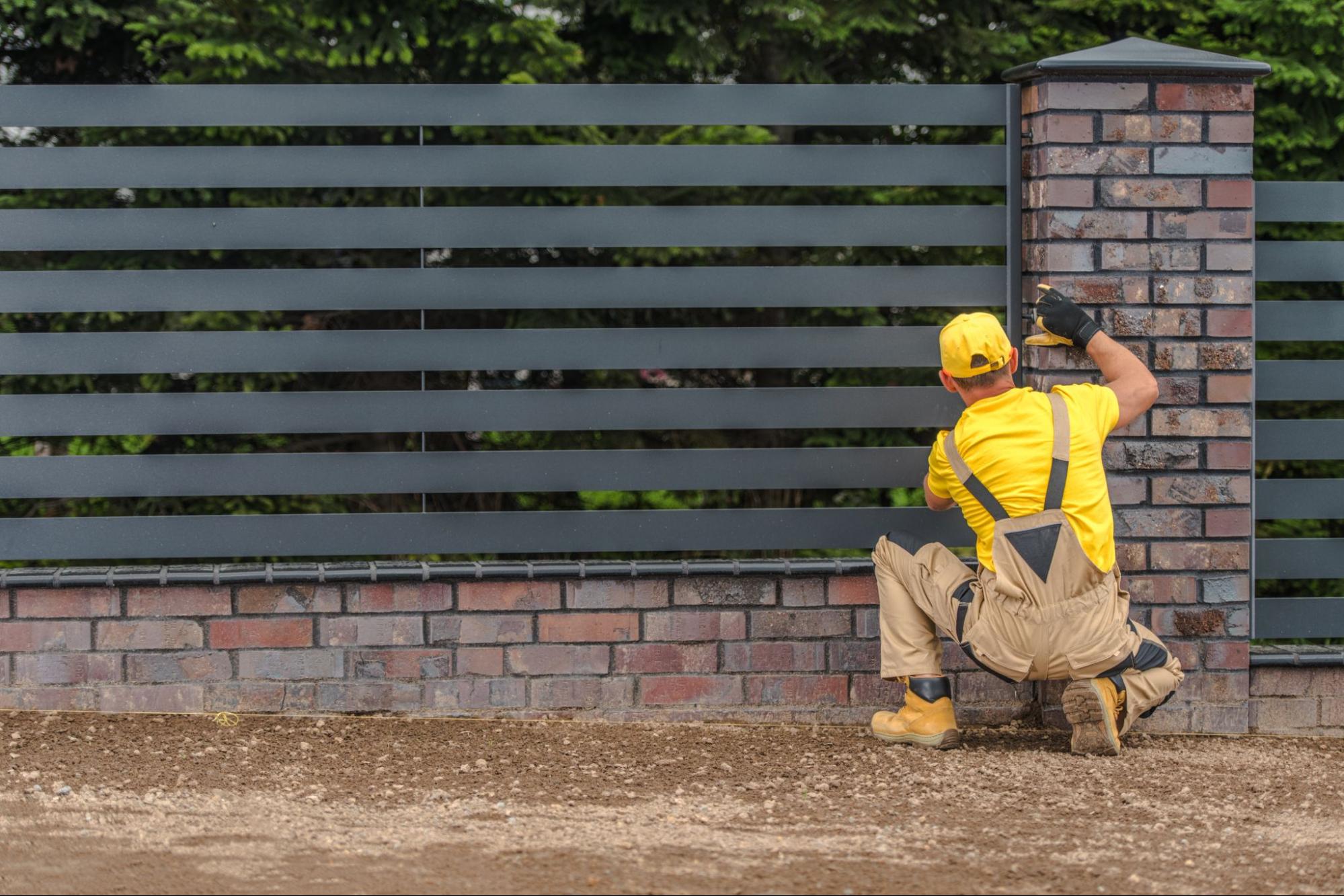 Man installing a fence.