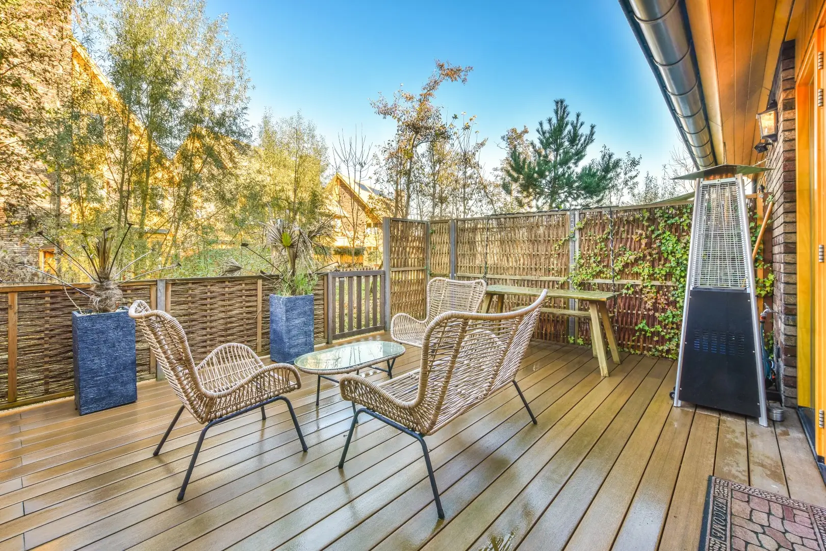 A cozy terrace featuring a beautifully crafted wooden deck floor.