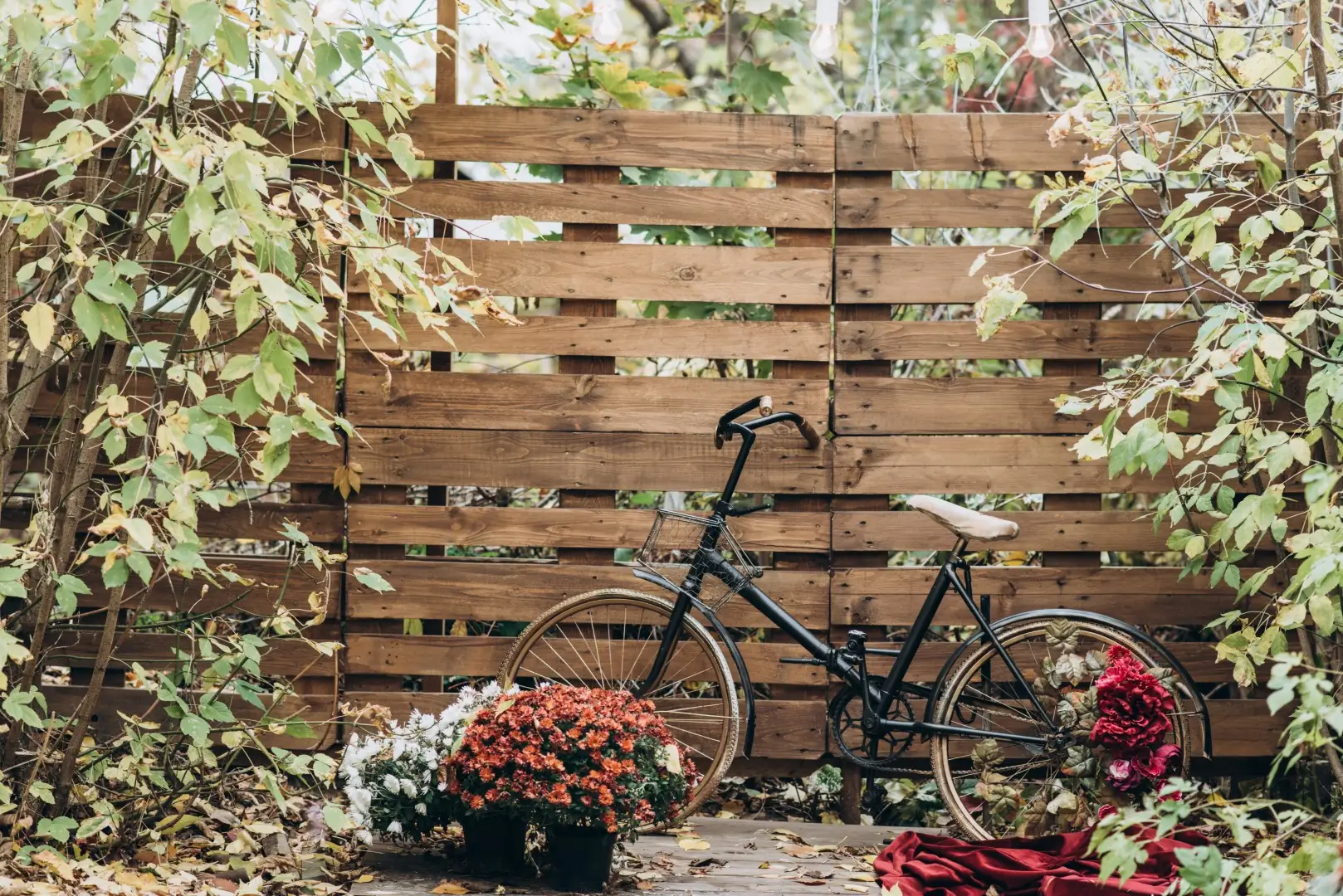 A neat wooden fence made of reclaimed pallet wood, offering a rustic touch to the outdoor space.