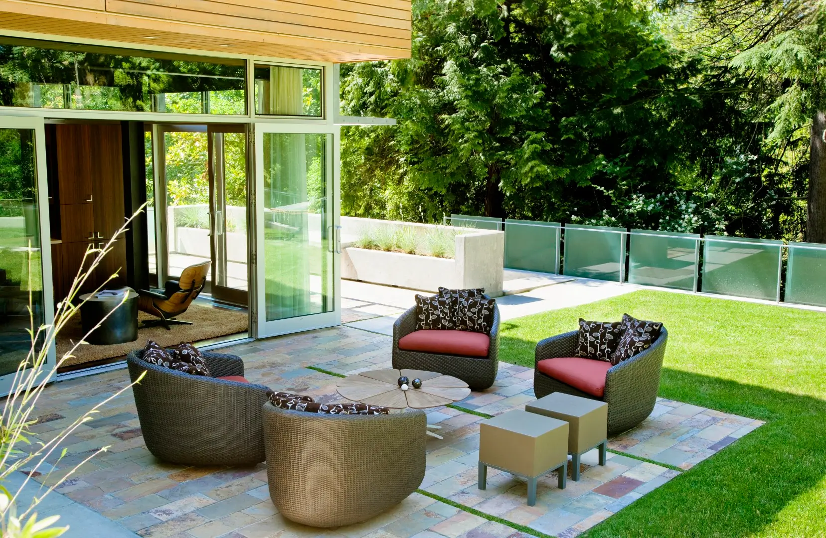 A shot of a scenic view of a patio with comfortable chairs.