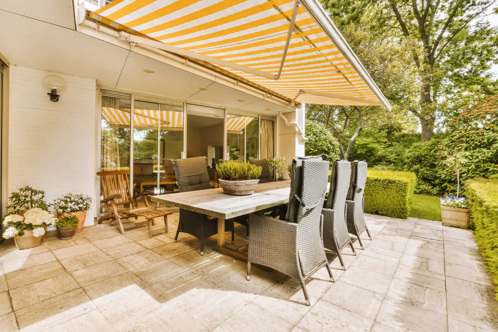Awning over an outdoor dining area at a home.