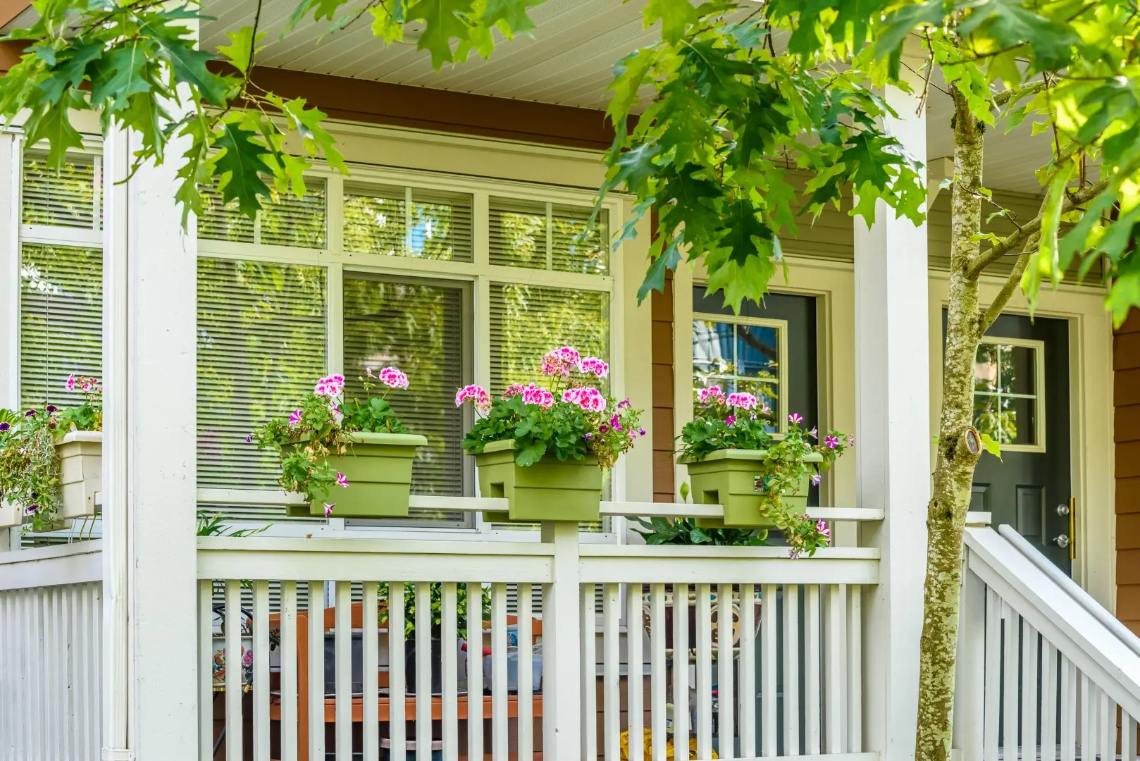 Vinyl deck rails next to potted plants.