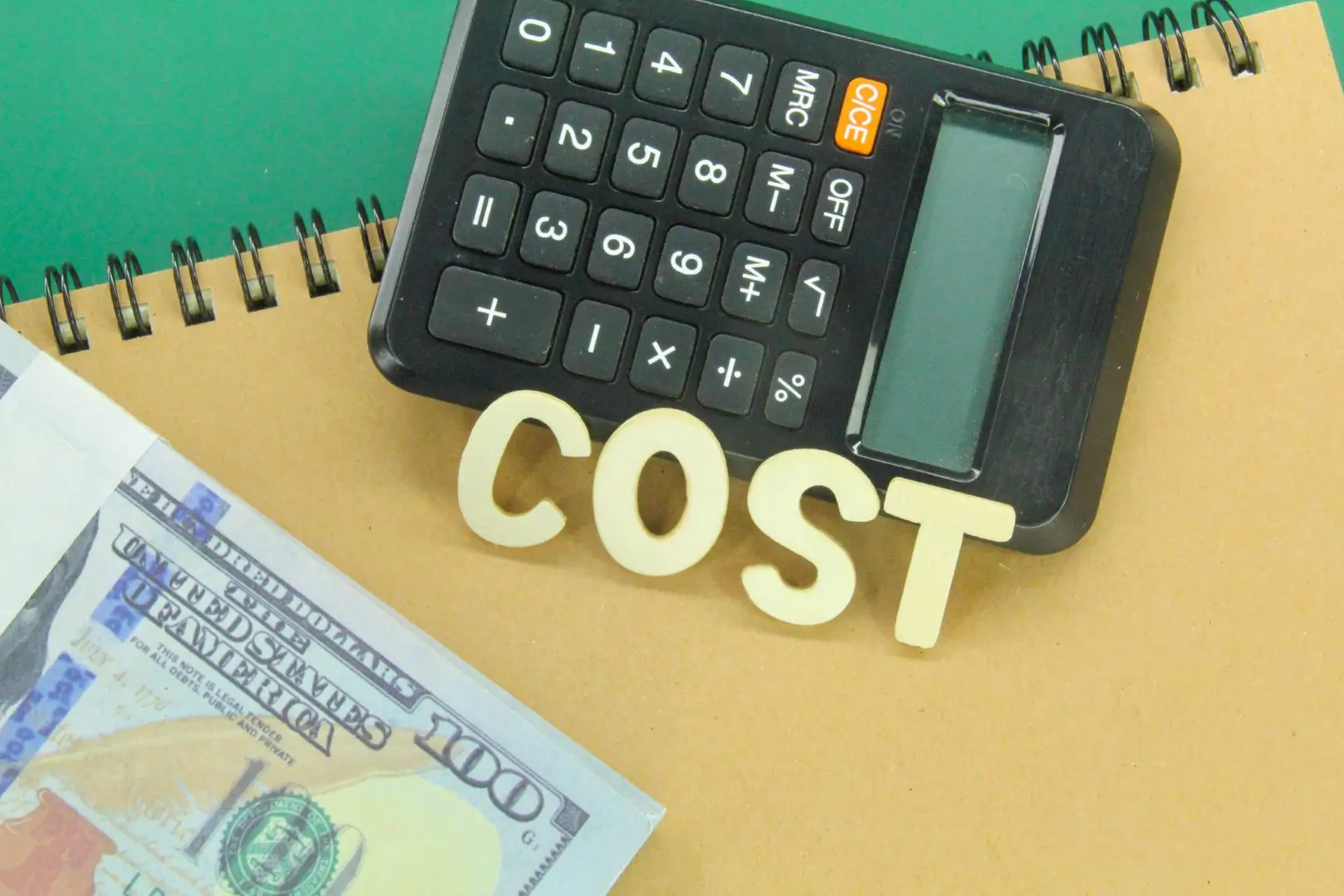 Word “cost” next to money, a binder, and a calculator.