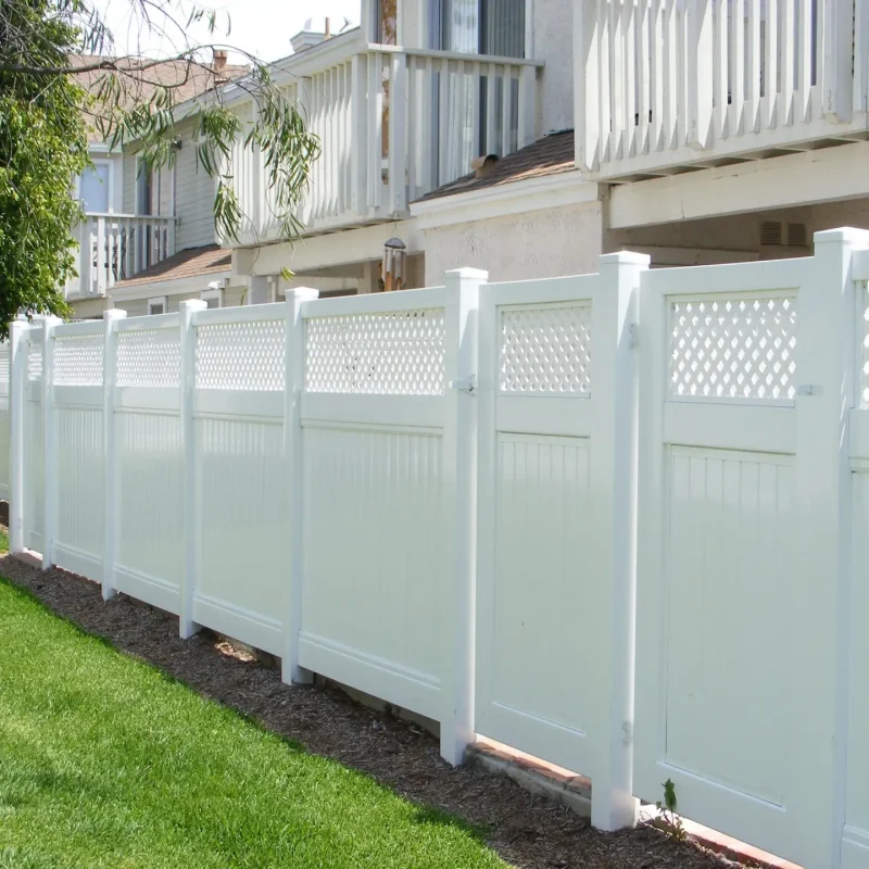 white fence with green grass