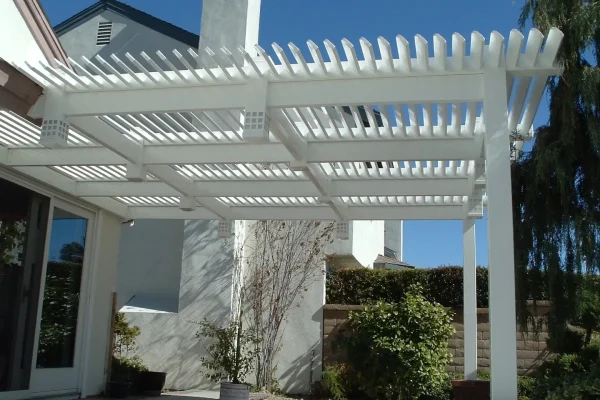 A patio cover with a big beautiful blue sky in the background.