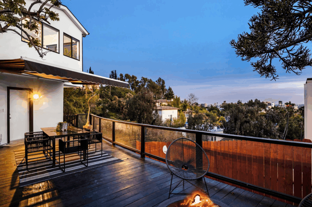 Deck rails surrounding a modern home in the hills.