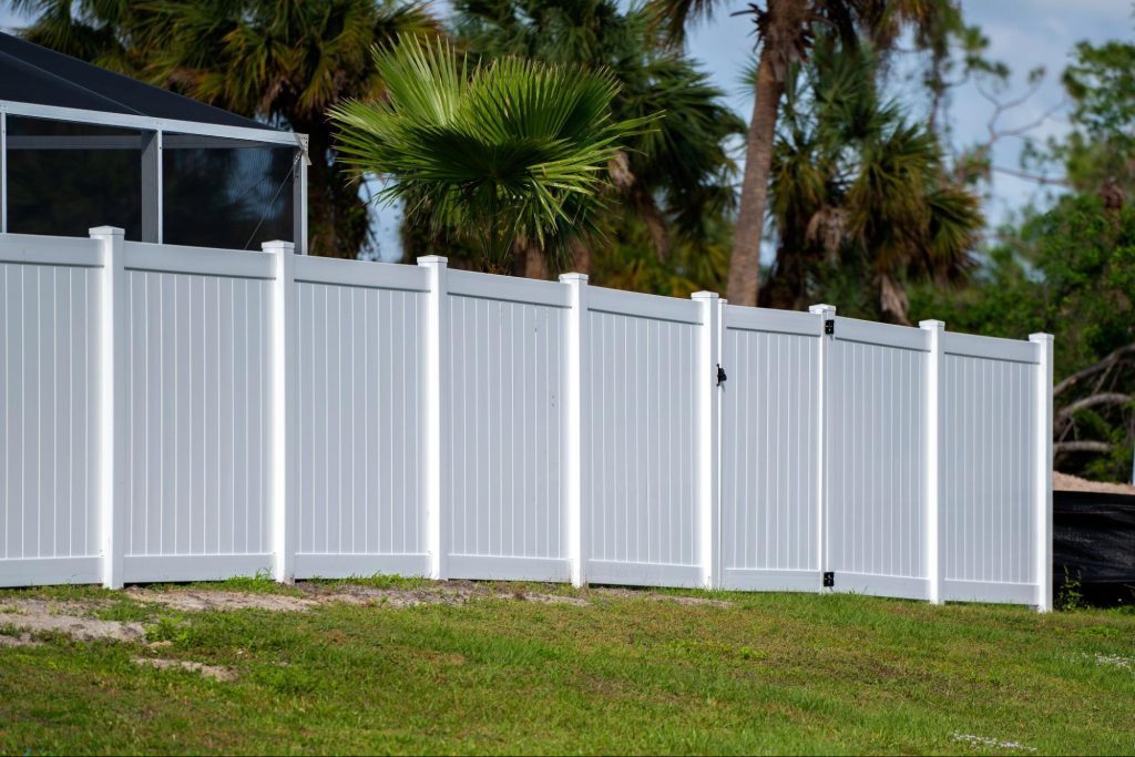 Vinyl fence around a home. 
