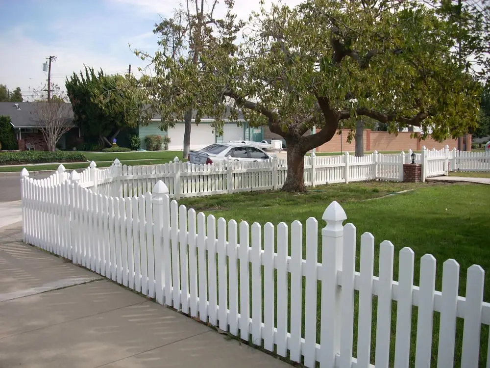 White fence in the front yard.